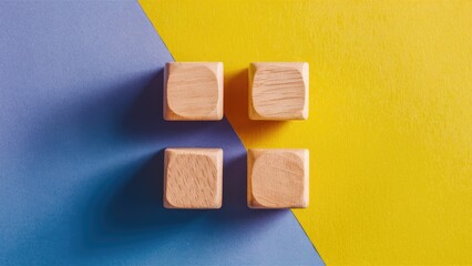Fototapeta premium Colorful Background Featuring Four Wooden Cubes.