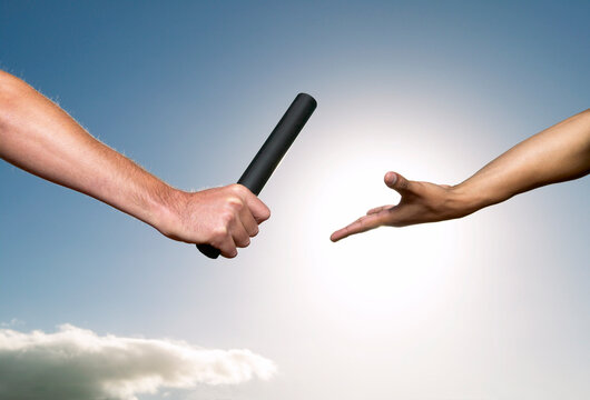 Hands Passing Baton
