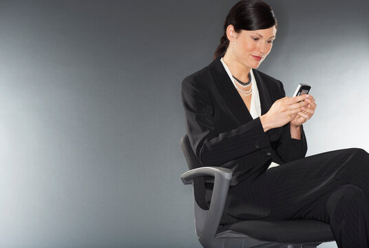 Businesswoman Sending Text Message