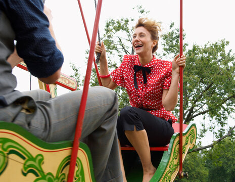 Couple Riding Swingboats, Carters Steam Fair, England