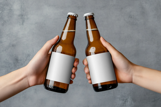 two hands holding beer bottles with white blank labels