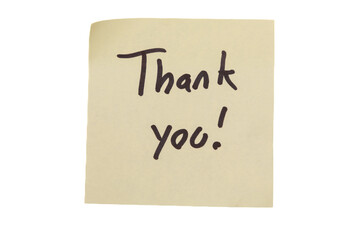 A piece of paper with the words "thank you" written in black. The paper is placed on a white background