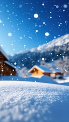 Scenic winter landscape with snow-covered cabins, falling snowflakes, and clear blue sky. Perfect for seasonal and holiday themes.