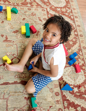 Girl Playing with Building Blocks