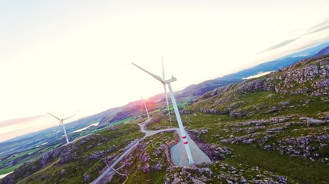 FPV Drone Short, Wind Turbines Network in Scenic Rural Landscape at Sunset
