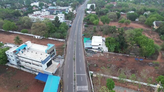 Early-morning aerial footage shows Tanjore's Church situated on a highway surrounded by open space and foliage, while the main state highway is seen completely devoid of cars.