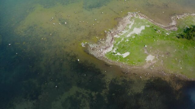 Top down aerial view of seabed. Texture and colors of sea water in daylight.