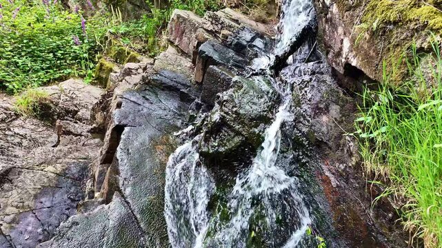 Close-up view about the Val Sans Retour park little waterfall, Tr&eacute;horenteuc, France.