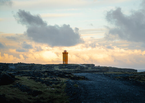 Icelandic landscape with orange lighthouse