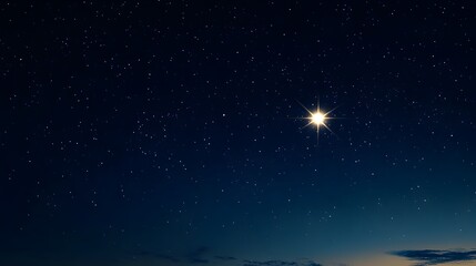 Obraz premium A lone shimmering star illuminates the serene boundless night sky evoking a sense of wonder and contemplation The celestial body stands out against the inky blackness