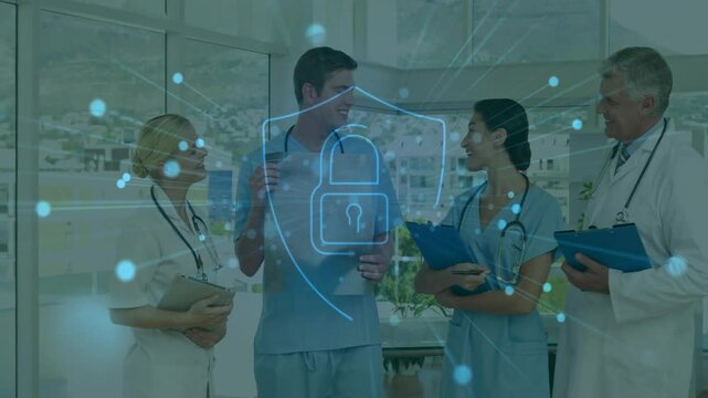 Medical professionals discussing patient care with cybersecurity animation over them