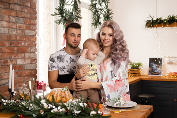 family enjoying their time together at home in the kitchen on Christmas time