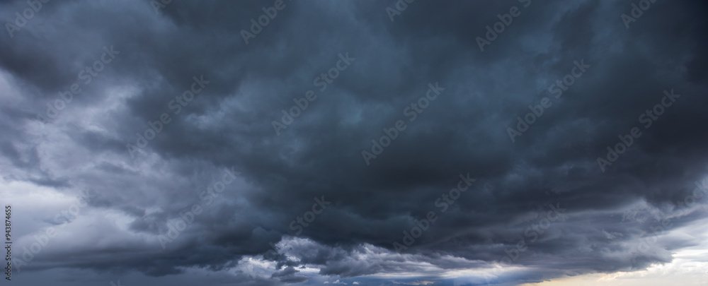 Poster the dark sky had clouds gathered to the left and a strong storm before it rained.bad weather sky.