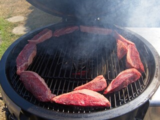 Picanha, or top sirloin cap, steaks on a charcoal grill