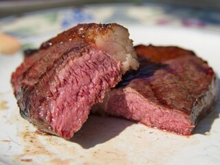 Picanha, or top sirloin cap, steaks on a charcoal grill
