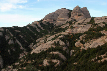 Panoramic view of the landscape with mountains against a blue sky with clouds in the National Park near the Monastery of Montserrat, Barcelona, Catalonia, Spain