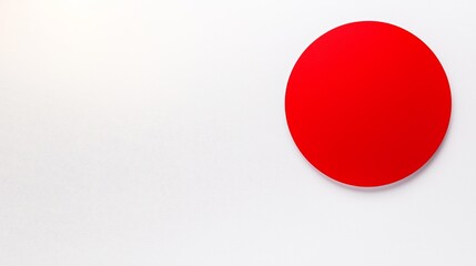 Modern graphic of the Japan flag with a sharp red circle against a smooth, white background, capturing the essence of Japanese identity
