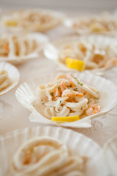 Close-up of Calamari Appetizers in Shell-shaped Dishes