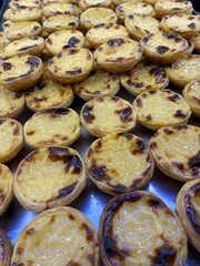 Pastel de Nata (cream tart) for sale as seen in pastry window. The custard tart is Portugal's most famous pastry cake. 
