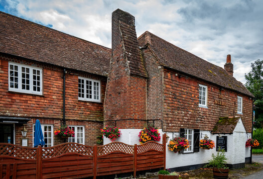 The Bat and Ball an 18th century pub known as the cradle of cricket stands opposite Broadhalfpenny Down on the Hambledon, Clanfield border.