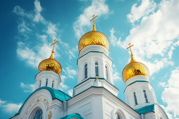 The three domes of a church are gold and blue