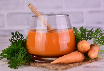 Carrot juice in a glass. Close-up. Vegetable juice.
