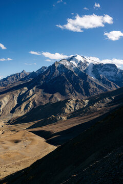 Beautiful rugged mountaintops in the Himalayas, and valley with road between Zangla and Wanla, Zanskar, Ladakh; Zanskar, Ladakh, India
