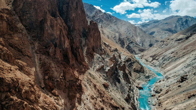 Beautiful Tsarap River flowing in a valley in mountainous terrain near Phuktal Gompa (Monastary), near Purne, Zanskar, Ladakh; Zanskar, Ladakh, India