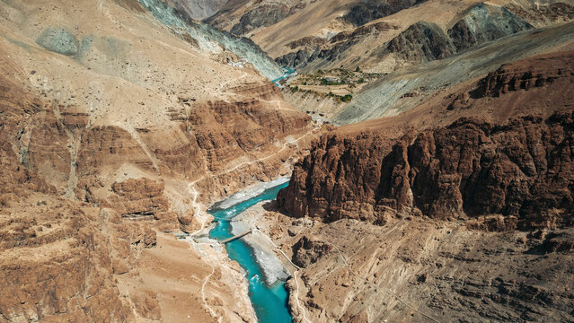 Beautiful Tsarap River flowing in a valley in mountainous terrain near Phuktal Gompa (Monastary), near Purne, Zanskar, Ladakh; Zanskar, Ladakh, India
