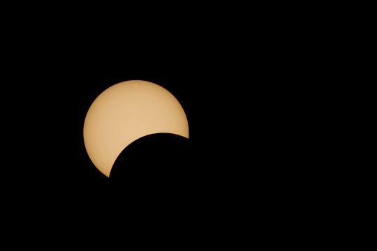 Moon begins to eclipse the sun during a total solar eclipse; Fredricton, New Brunswick, Canada