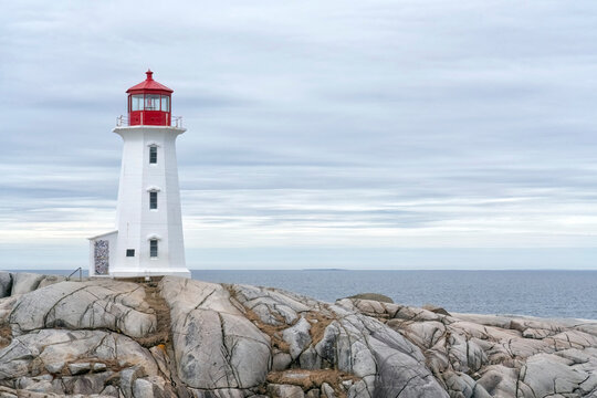 Peggy's Cove Lighthouse on a moody day in Nova Scotia on the Atlantic coast of Canada; Peggy's Cove, Nova Scotia, Canada