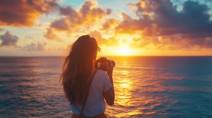 Fototapeta premium travel photography, a mindful traveler captures the serene beauty of a vibrant ocean sunset, fully embracing the present moment through their camera lens, finding pure joy