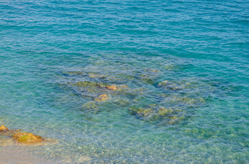 The sea in Spain with stones in summer