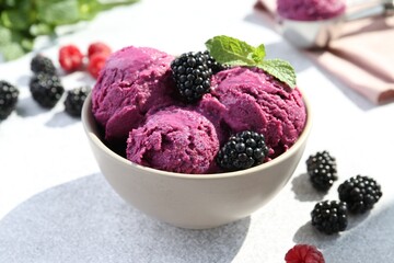 Delicious blackberry sorbet, mint and fresh berries on grey table, closeup