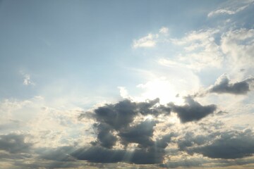 Sun shining through clouds on beautiful sky