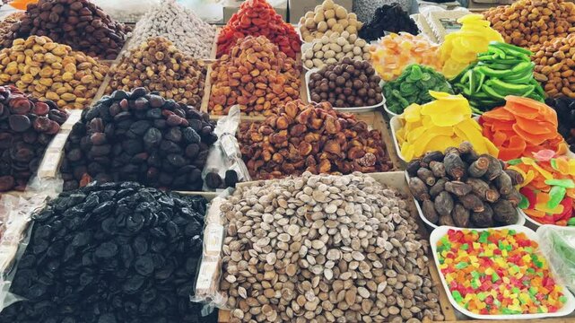 Nuts and Spices Market in Tashkent, Uzbekistan - June 29, 2023: Goods and traders at the Oriental Bazaar in Uzbekistan. The Chorsu market was known back in the Middle Ages. 4K
