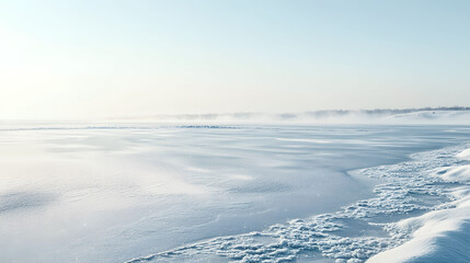 Obraz premium A serene winter landscape featuring vast expanse of snow covered ground under pale blue sky. scene evokes sense of calm and tranquility.