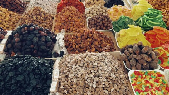 Nuts and Spices Market in Tashkent, Uzbekistan - June 29, 2023: Goods and traders at the Oriental Bazaar in Uzbekistan. The Chorsu market was known back in the Middle Ages. 4K