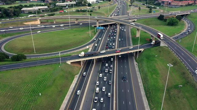 Drone, road and traffic on highway of city for travel, transportation and landscape. Infrastructure, cityscape and intersection with ariel view of cars urban town for street, development and location