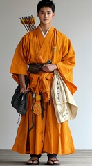 Obraz premium Young Man in Traditional Japanese Monk Robes with Quiver of Arrows