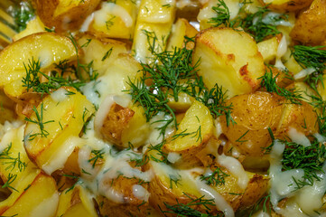 Baked potatoes in the peel stuffed with cheese with garlic and herbs.1