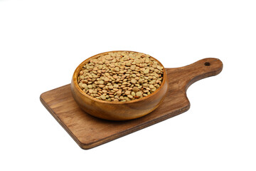 Green lentils in wooden bowl on isolated white background. Top view, copy space. Flat lay.