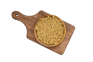 Green lentils in wooden bowl on isolated white background. Top view, copy space. Flat lay.