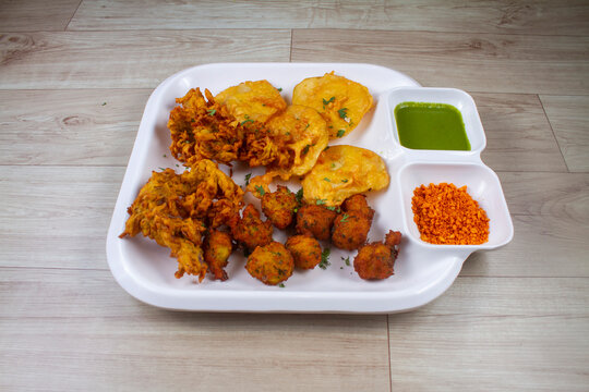 mix pyaz or kanda , aloo or batata and moong bhaji or pakoda indian snacks food.