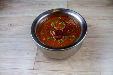 Popular Indian Food Known as spicy Pakora kadhi is served in a bowl. (Indian Food Concept)