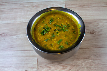 dalimbi usal Maharashtrian popular nutritious breakfast, isolated over a rustic wooden background, selective focus
