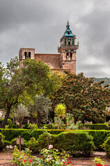 Naklejka premium A portrait shot of the monastery in the pretty town of Valdemossa on the Spanish island of Majorca
