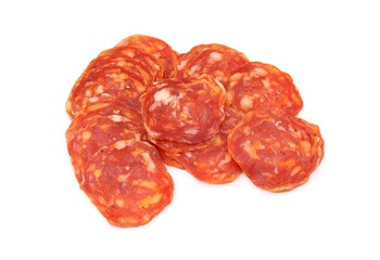Slices of spicy seasoned salami Napoli on white background.