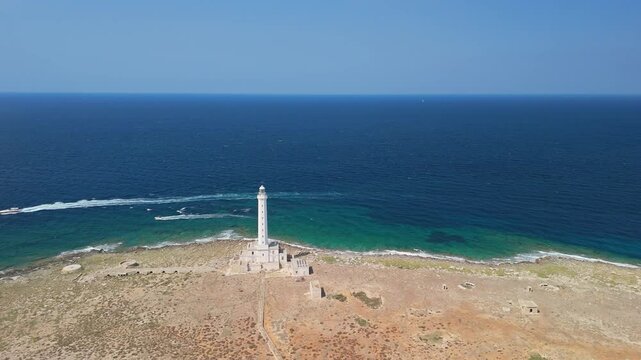 Spectacular aerial view of a beautiful white lighthouse on a desert island