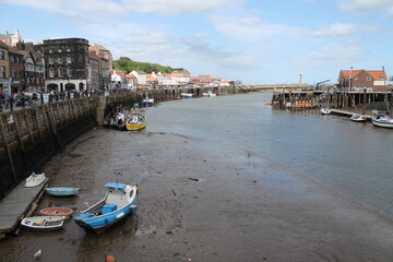 Whitby North Yorkshire UK 21st August 21 2024 Whitby a British seaside town  with boats moored in the harbour on a  hot summers